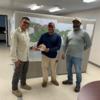 UXOSO Jose Ramos, Jr. (left) and SUXOS Jose Gomez (right) present the Safety Star Award to Juan Melendez (center)