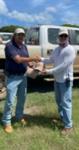 Project Manager Bob Hannan (left) presents the Safety Star Award to John Carpenter (right)