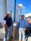 Project Manager Bob Hannan (left) presents the Safety Star Award to Gypsy Cordova (right)