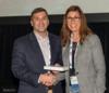 NAOC VP, Courtney Ingersoll, presenting the award to USA VP, Brian Skubin, on Connie's Behalf